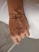 PULSEIRA COM BOLINHAS E CORAÇÃO NO MEIO - BANHADO A RODIO BRANCO