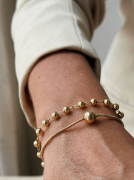 PULSEIRA ESFERAS LISAS - BANHADO A OURO
