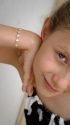 PULSEIRA INFANTIL TREVOS DE PÉROLA - BANHADO A OURO